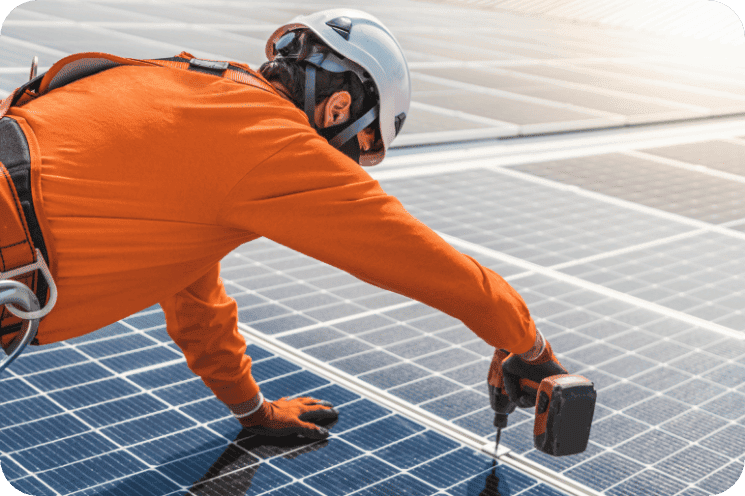 Solar technician installing solar panels on a rooftop for clean energy solutions.